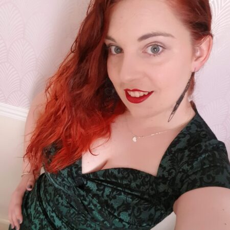 Selfie of me with red hair, wearing a green dress